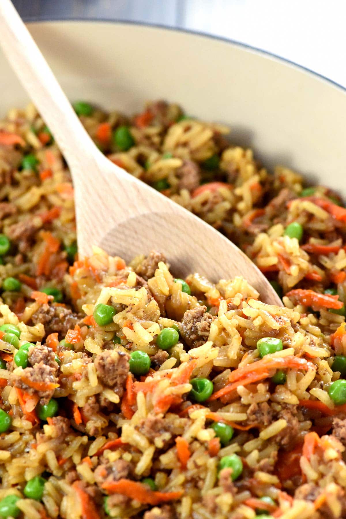 Asian Ground Beef and Rice with wooden spoon.