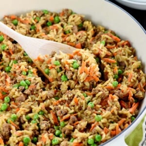 Asian Ground Beef and Rice recipe in pan with wooden spoon.
