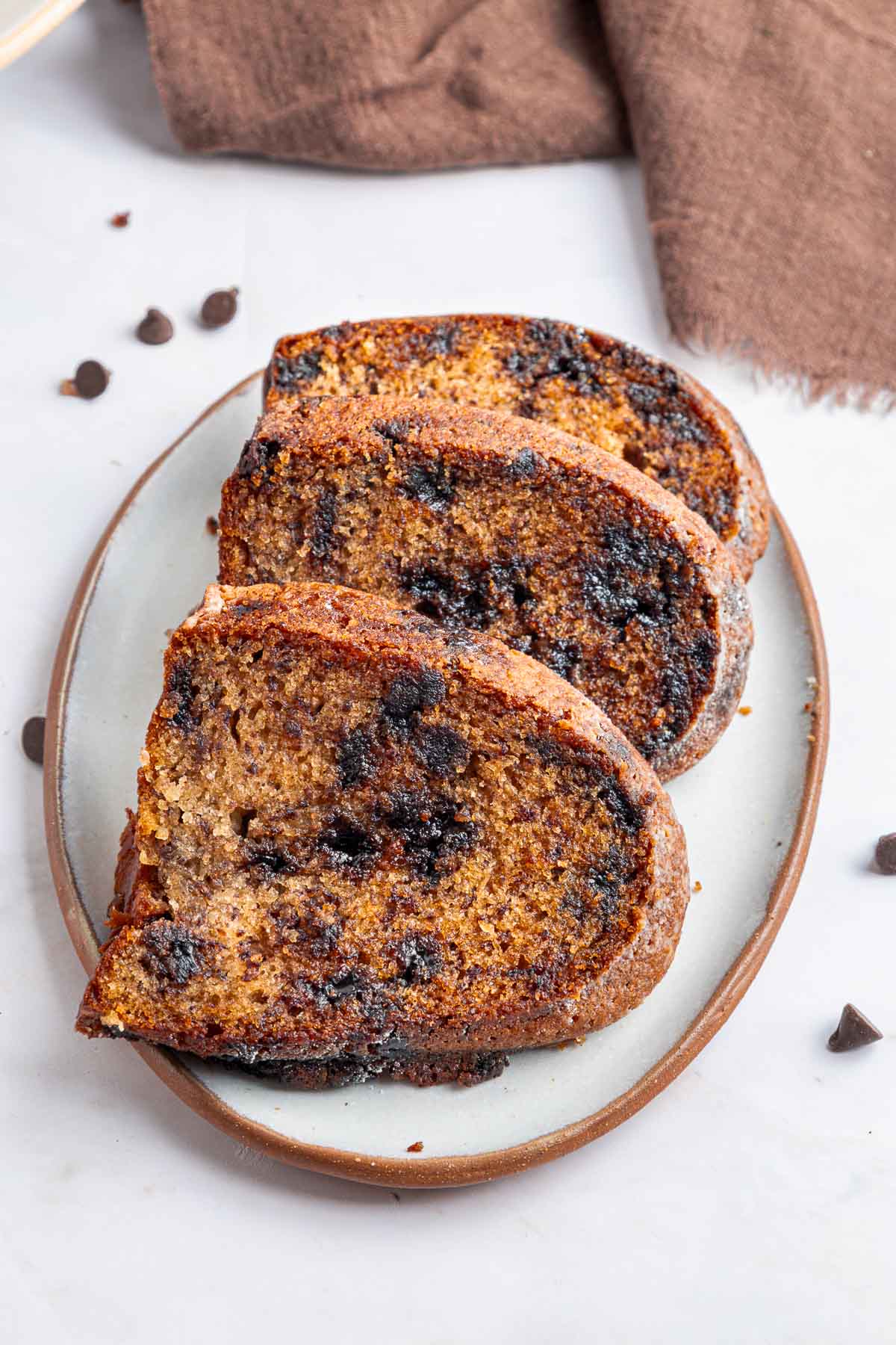 Banana Chocolate Chip Cake slices on plate.