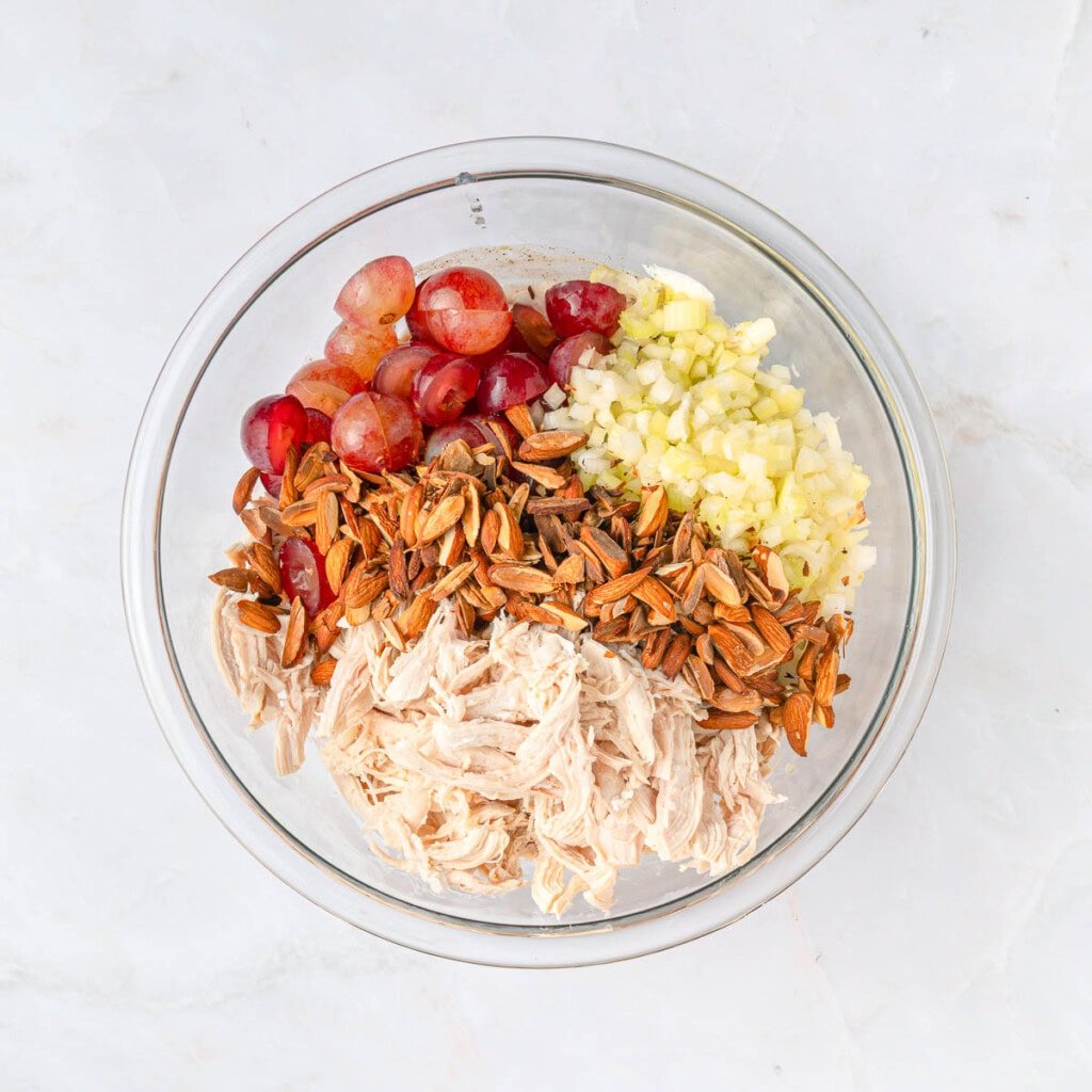 Adding remaining ingredients to bowl.