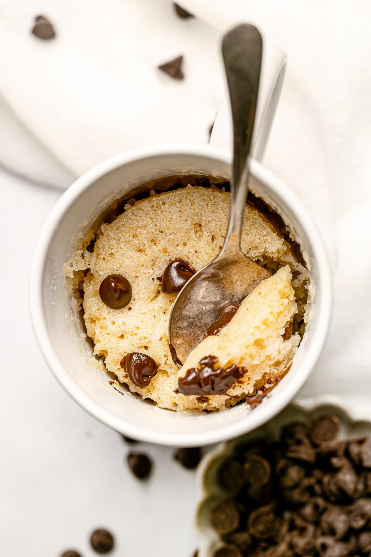 Chocolate Chip Mug Cake with spoon.