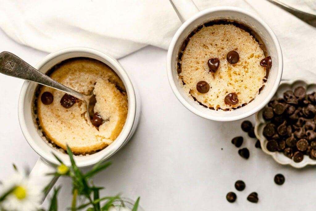 Chocolate Chip Mug Cake cooked in two mugs.