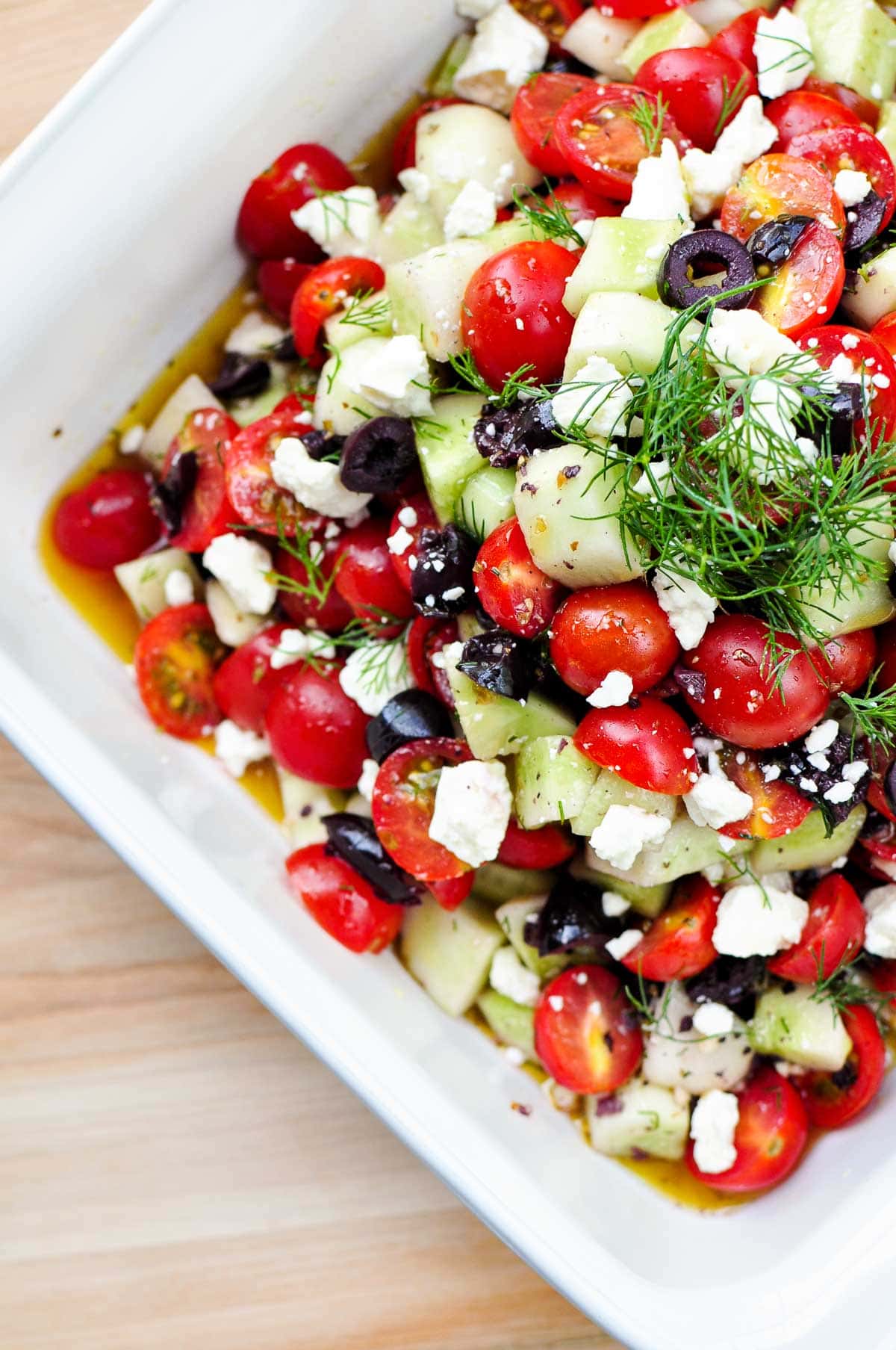 Tomato Cucumber Feta Salad aerial view in bowl.