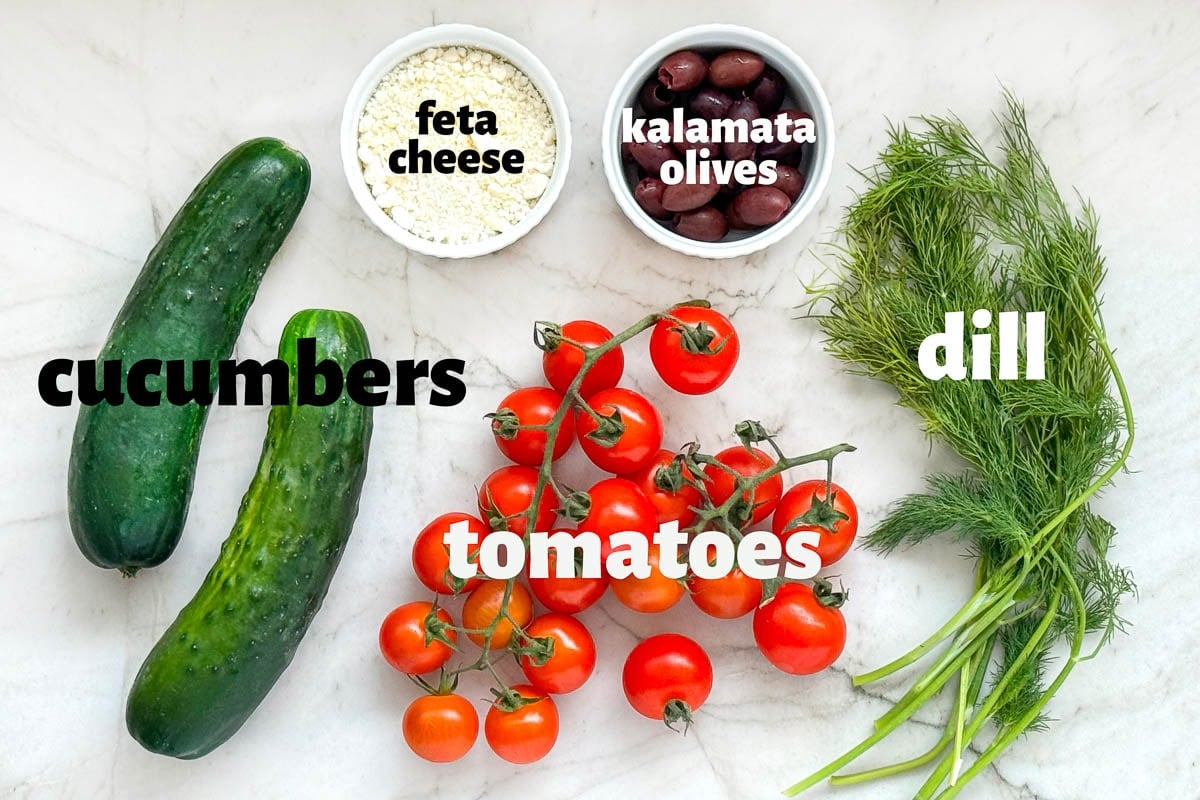 Labeled ingredients to make Cucumber Tomato Feta Salad.