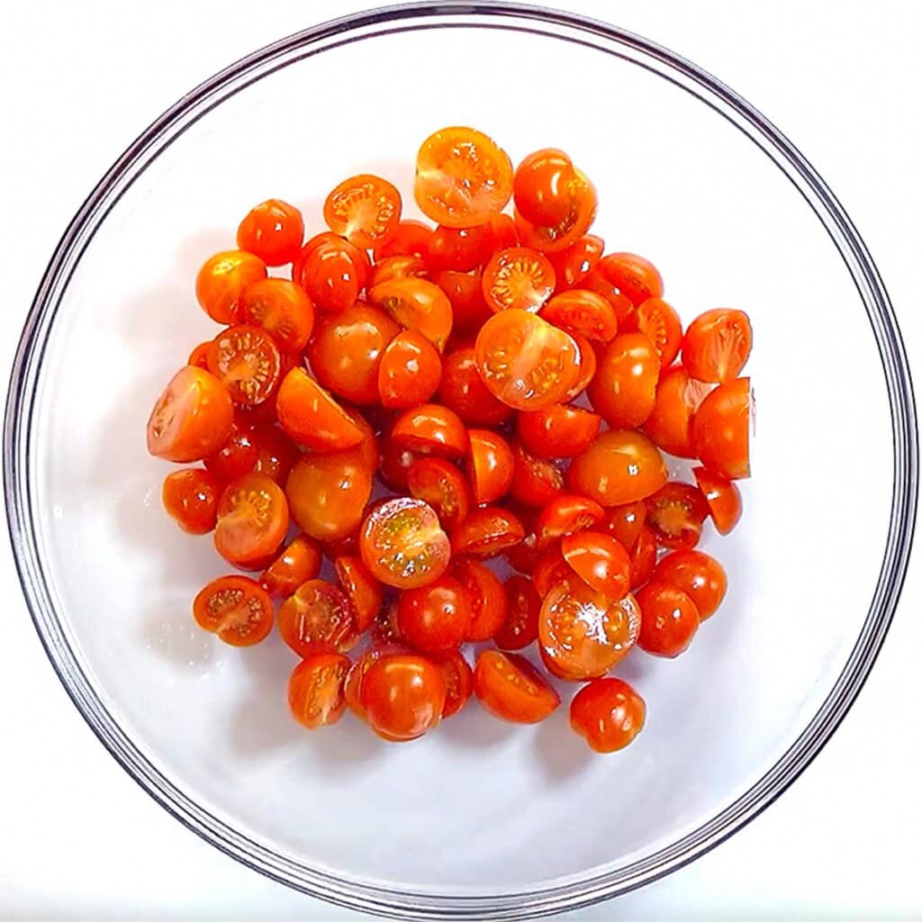 Bowl of tomatoes for base of tomato cucumber feta salad.
