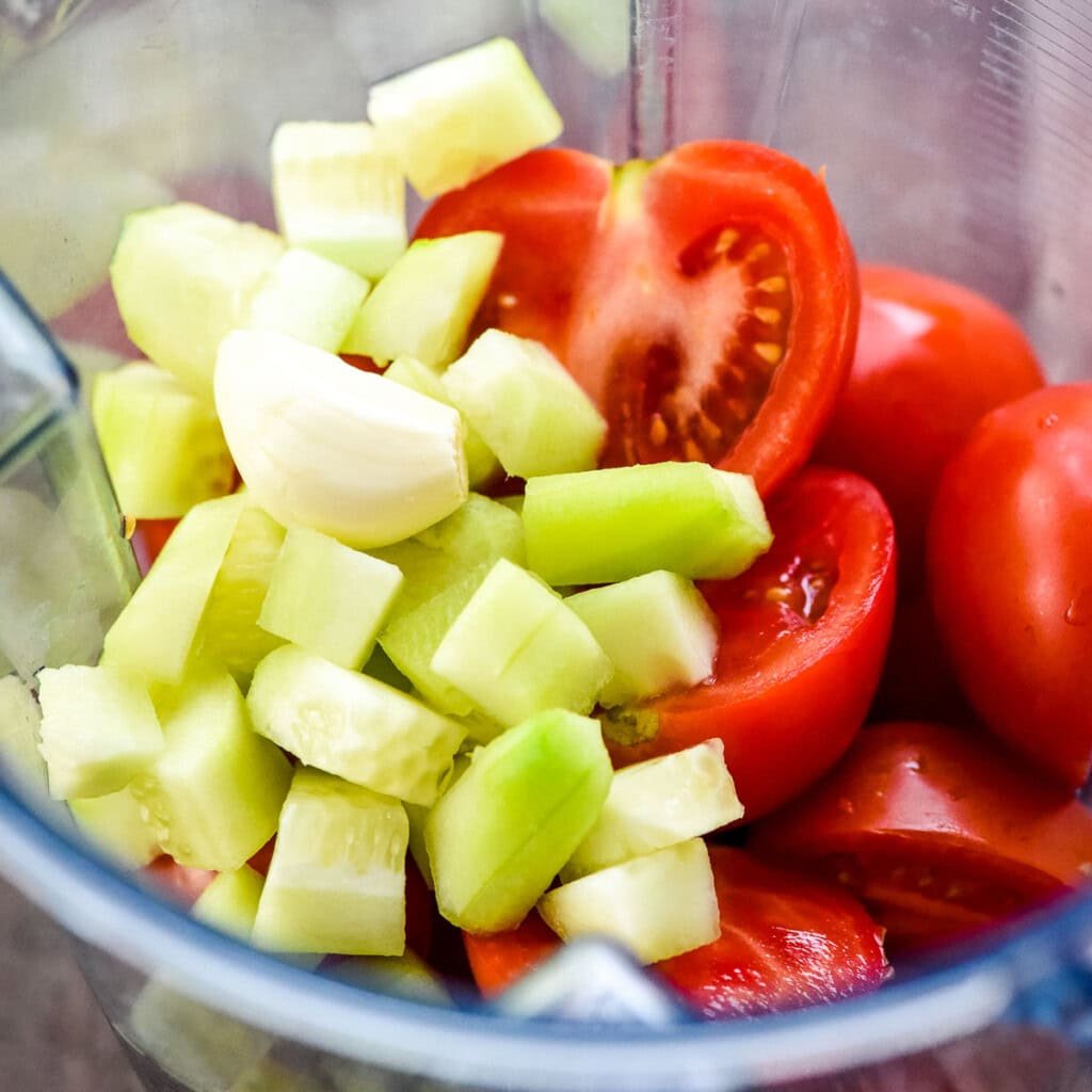 Tomatoes, cucumber, and garlic in blender.