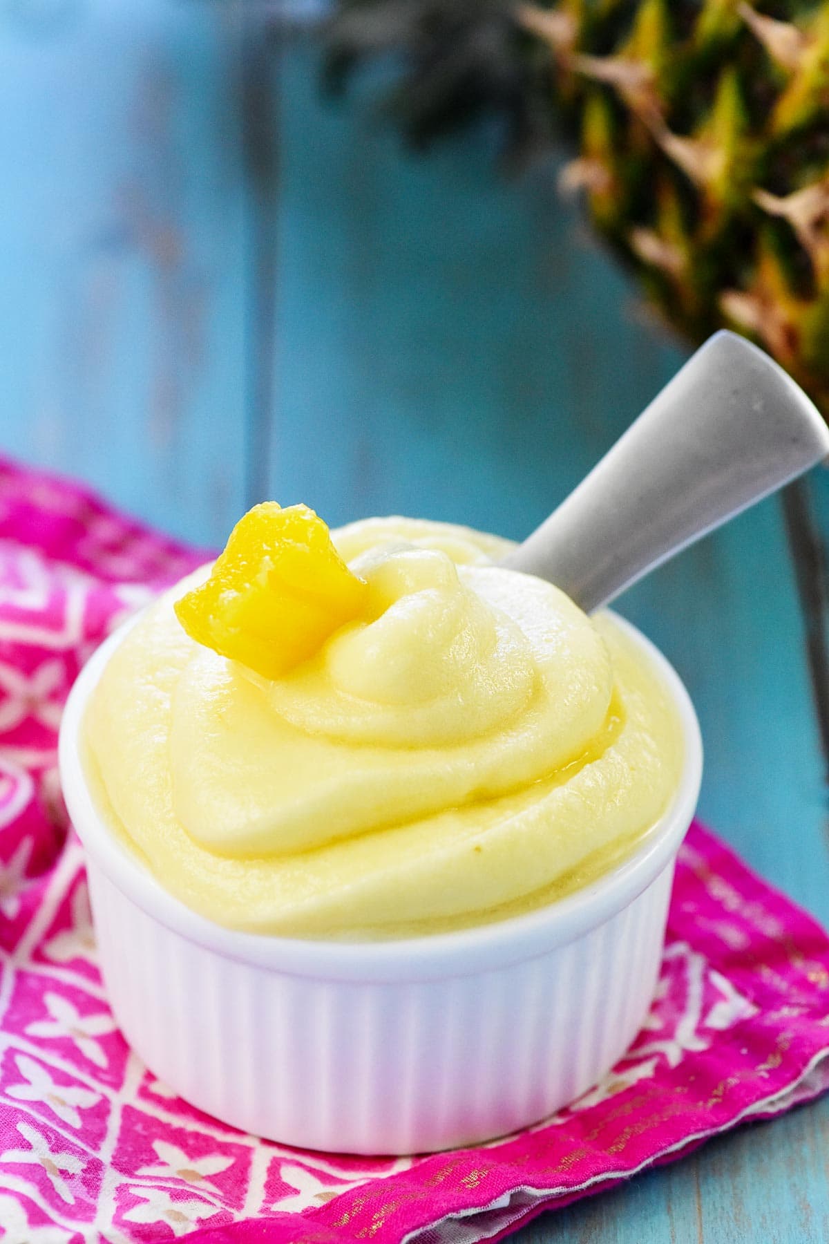 Pineapple Dole Whip in bowl with spoon.