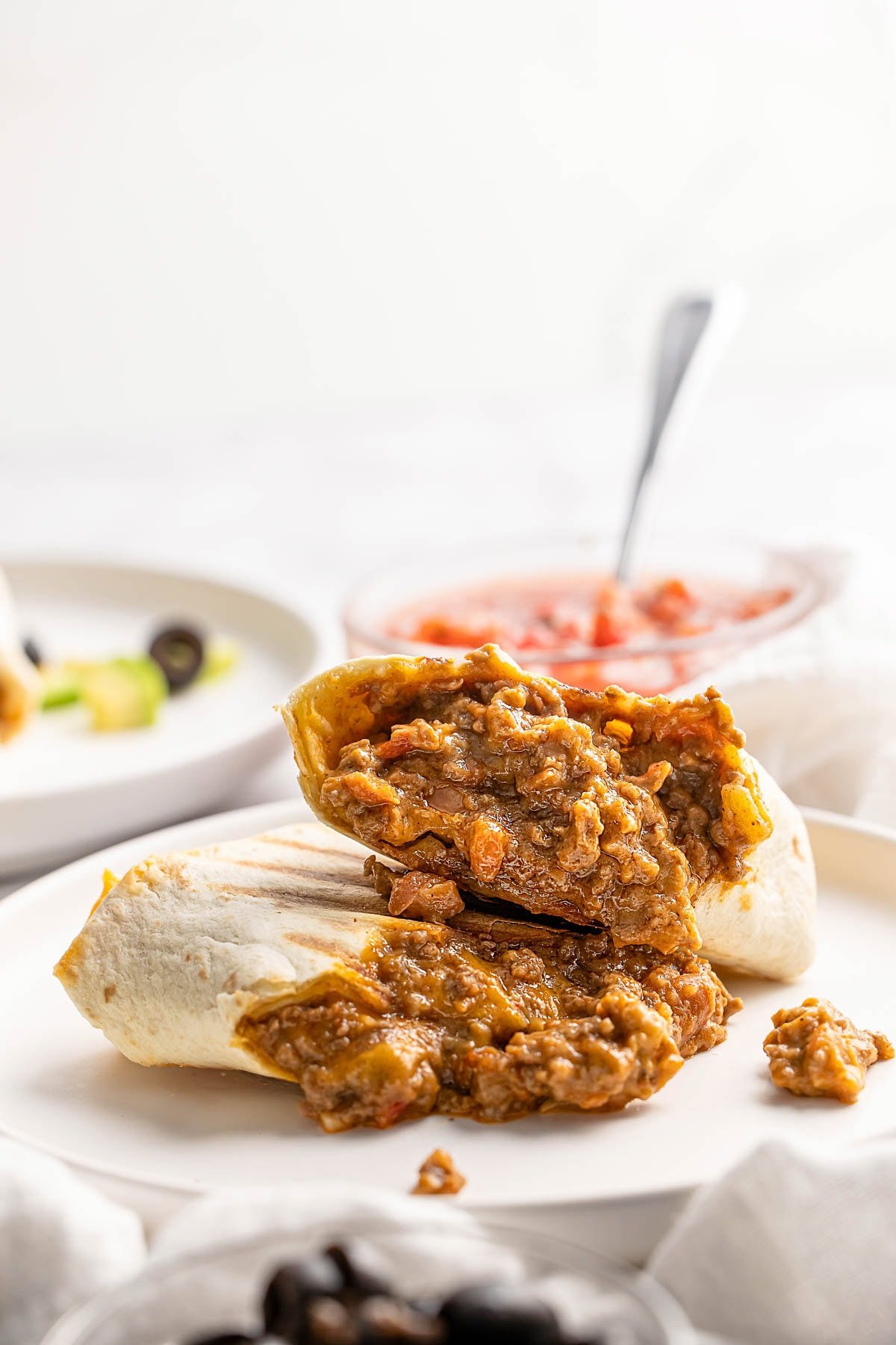 Beef and Bean Burritos sliced in half.