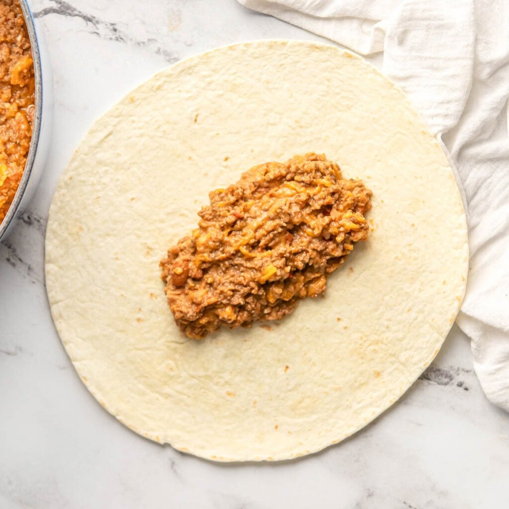 Beef and Bean Burritos being assembled.