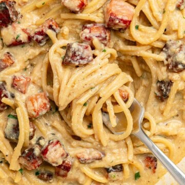 Carbonara Recipe aerial view on fork in pan.