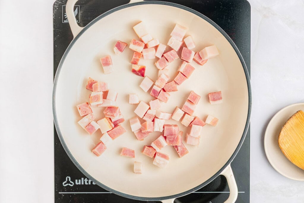 Pancetta cubes in pan.