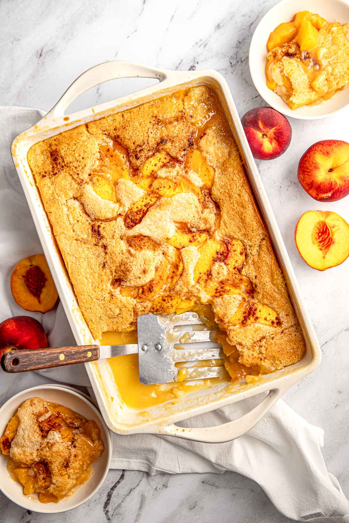 Easy Peach Cobbler aerial view in baking dish and bowl.