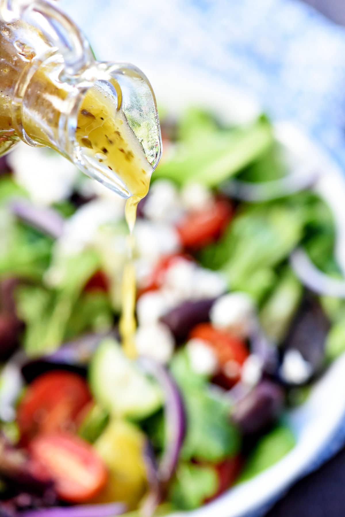 Greek Salad Dressing poured over salad.