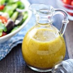 Greek Salad Dressing close-up in glass bottle.