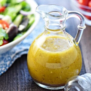 Greek Salad Dressing close-up in glass bottle.