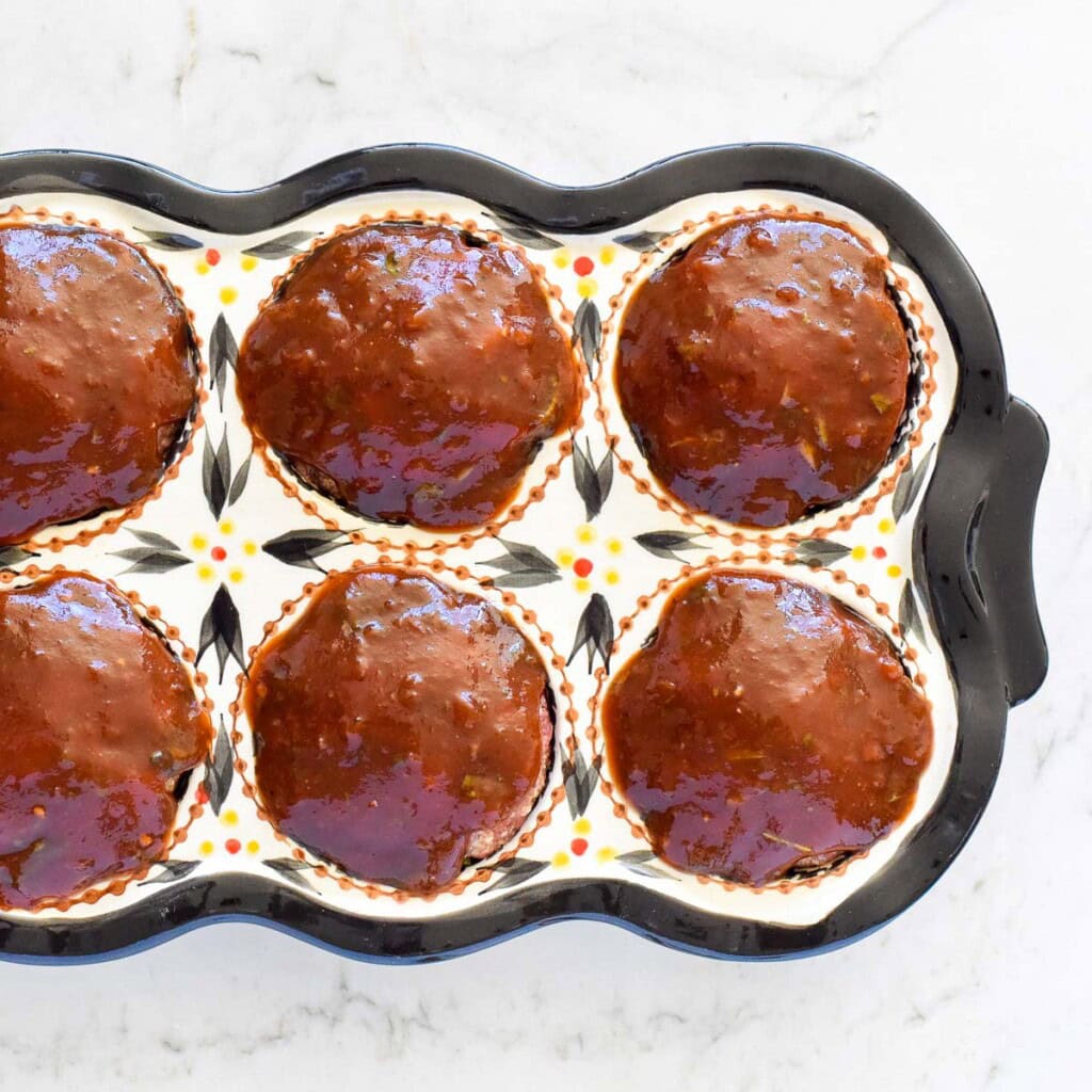 Aerial view of muffin tin meatloaf ready for oven.