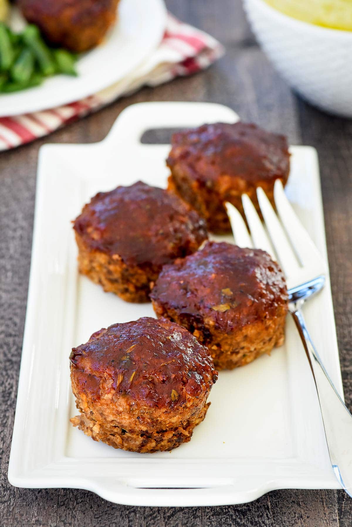 Meatloaf Muffins on platter with fork.