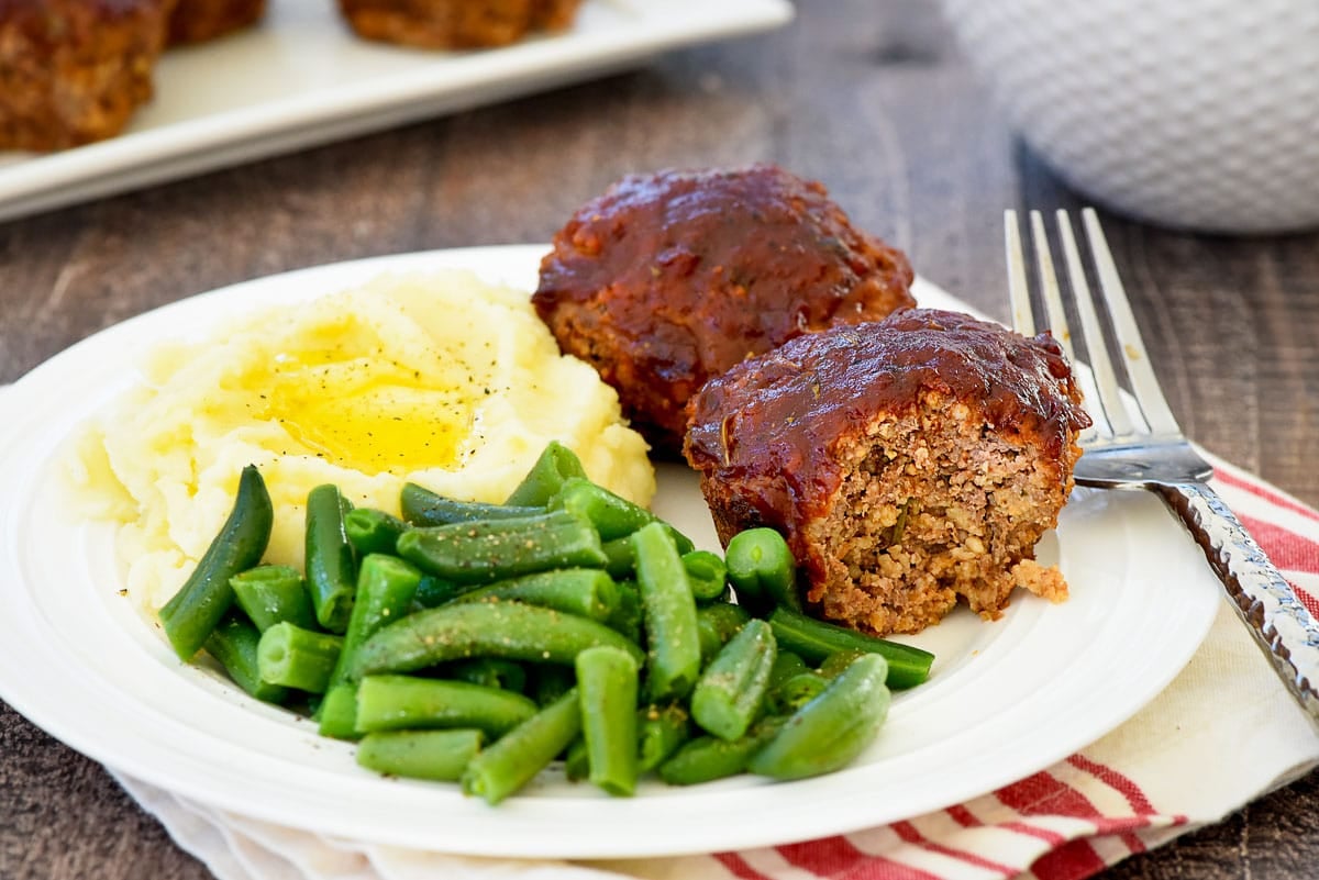 Meatloaf Muffins on plate with fork and missing bite.