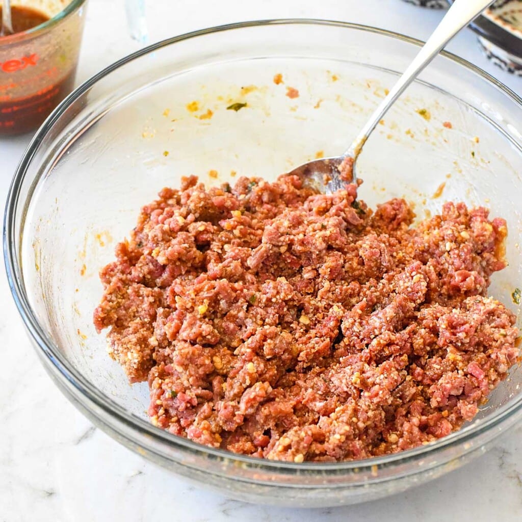 Mixture for mini meatloaf recipe combined in bowl.
