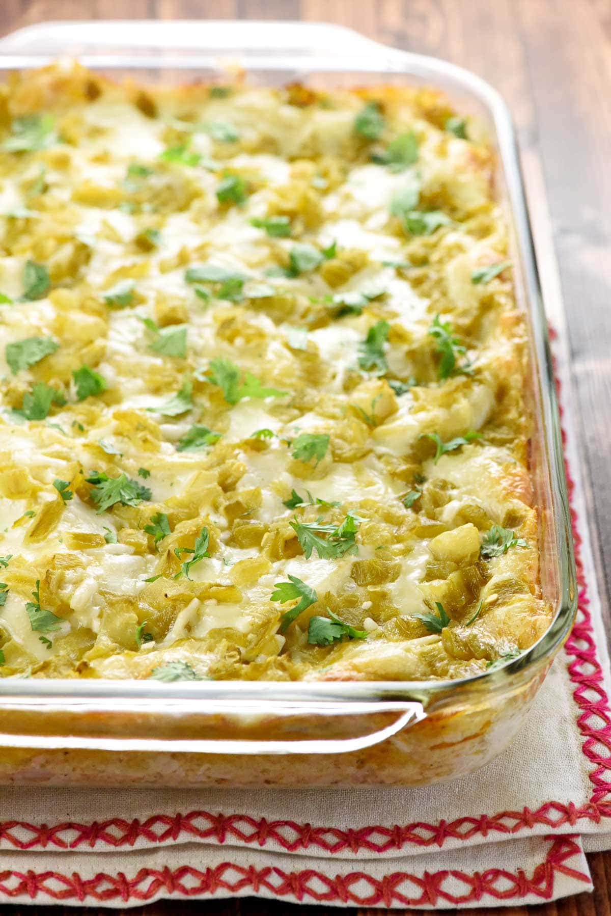 Chicken Enchilada Casserole in baking dish fresh out of the oven.