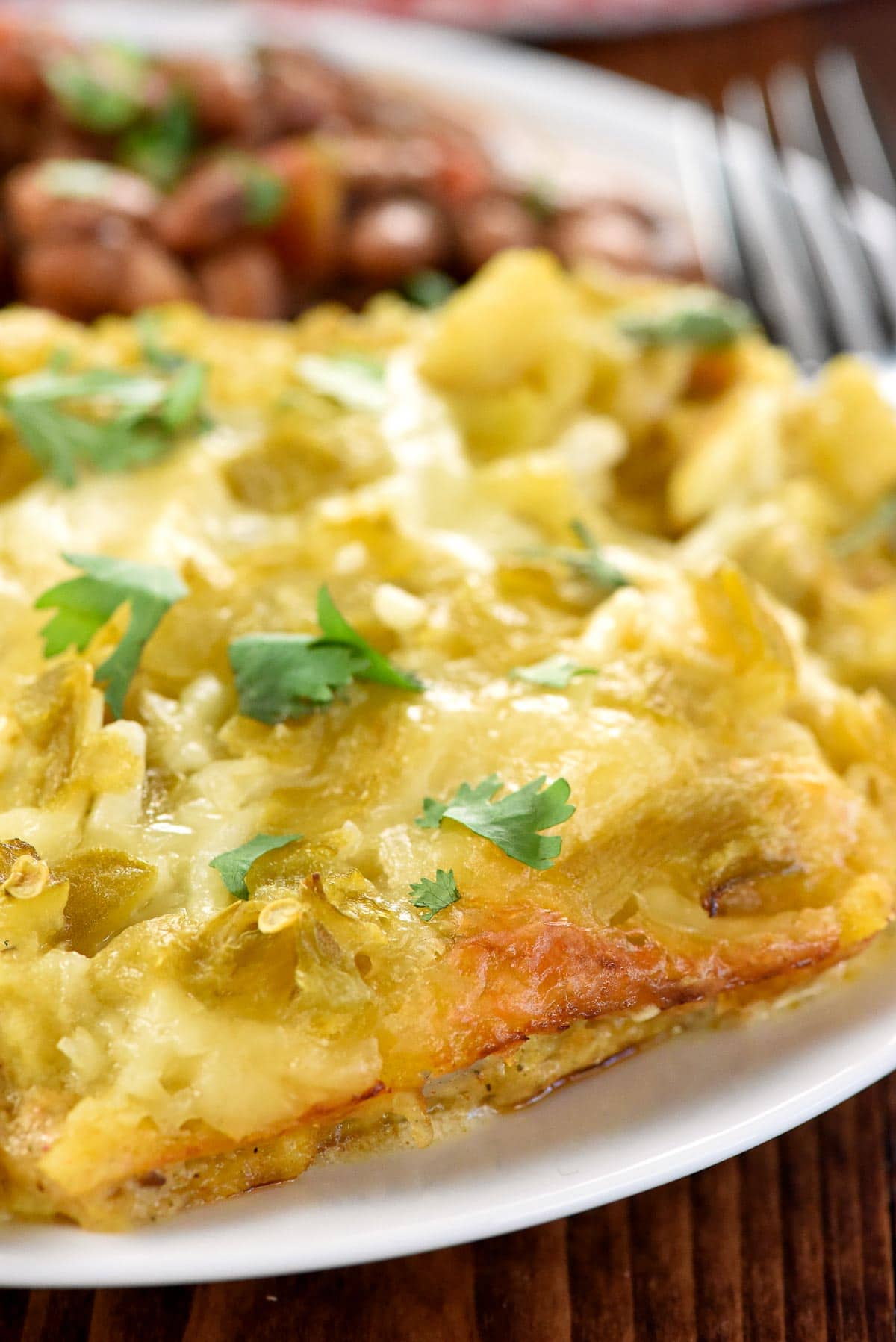 Chicken Enchilada Casserole close-up on plate.