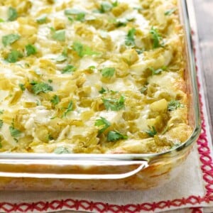 Chicken Enchilada Casserole in baking dish with cilantro garnish.