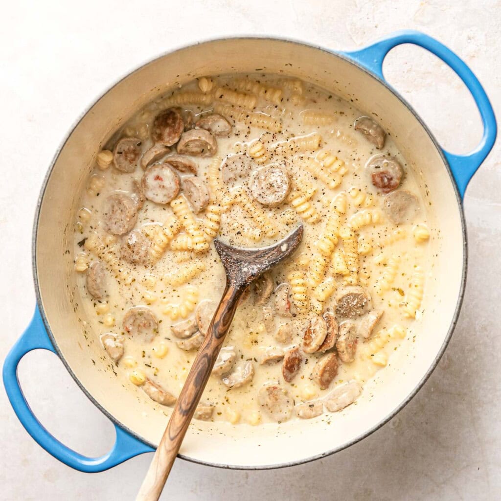 Chicken Sausage Pasta seasoned with pepper and ready to serve.
