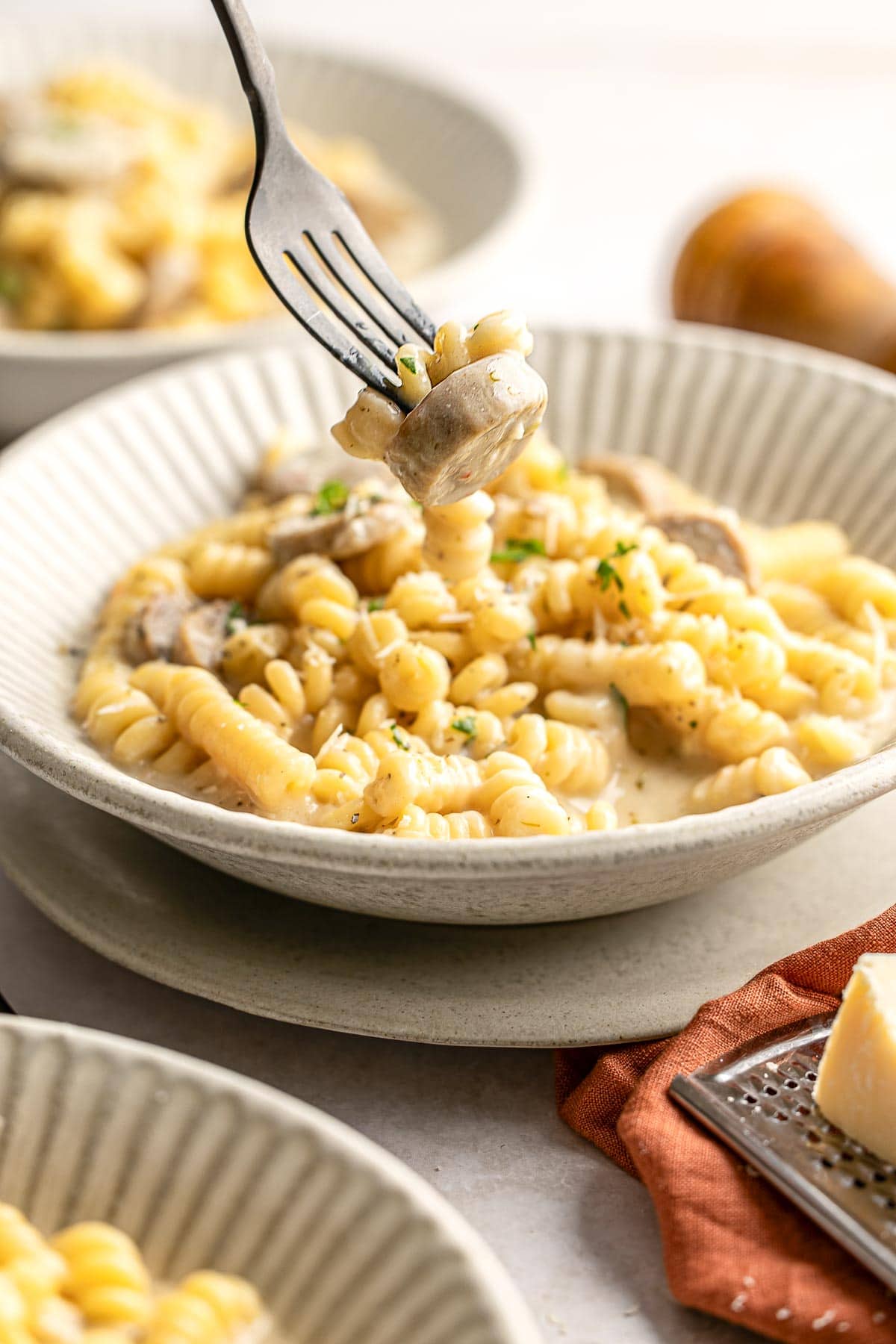 Chicken Sausage Pasta with bite on fork.