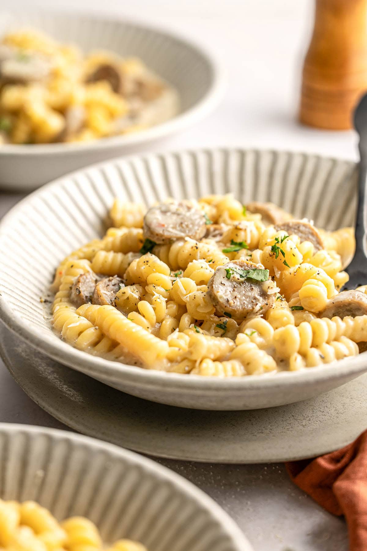 Chicken Sausage Pasta in bowl with fork.