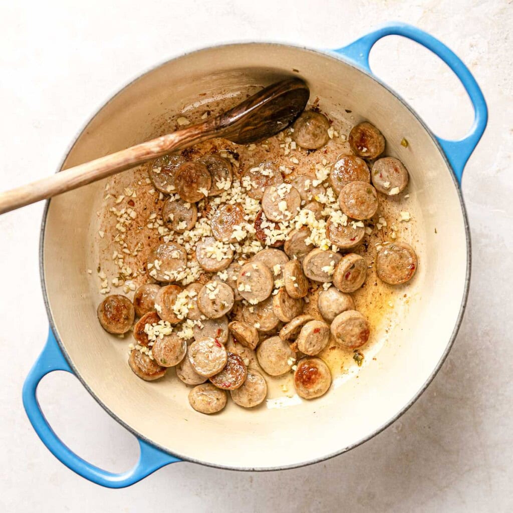 Adding garlic for Chicken Sausage Pasta.
