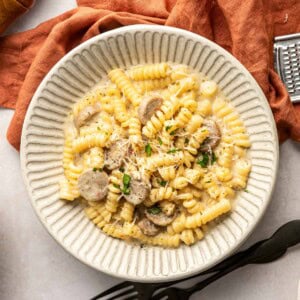 Chicken Sausage Pasta aerial view in bowl with garnishes.