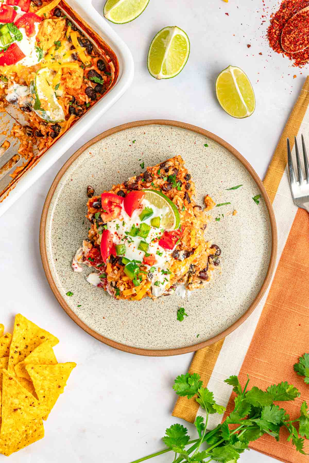 Mexican Chicken and Rice Casserole on plate and in baking dish.
