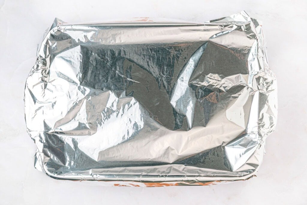 Mexican Chicken and Rice Casserole covered with foil and ready for oven.