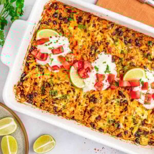 Mexican Chicken and Rice Casserole aerial close-up in baking dish with garnishes.