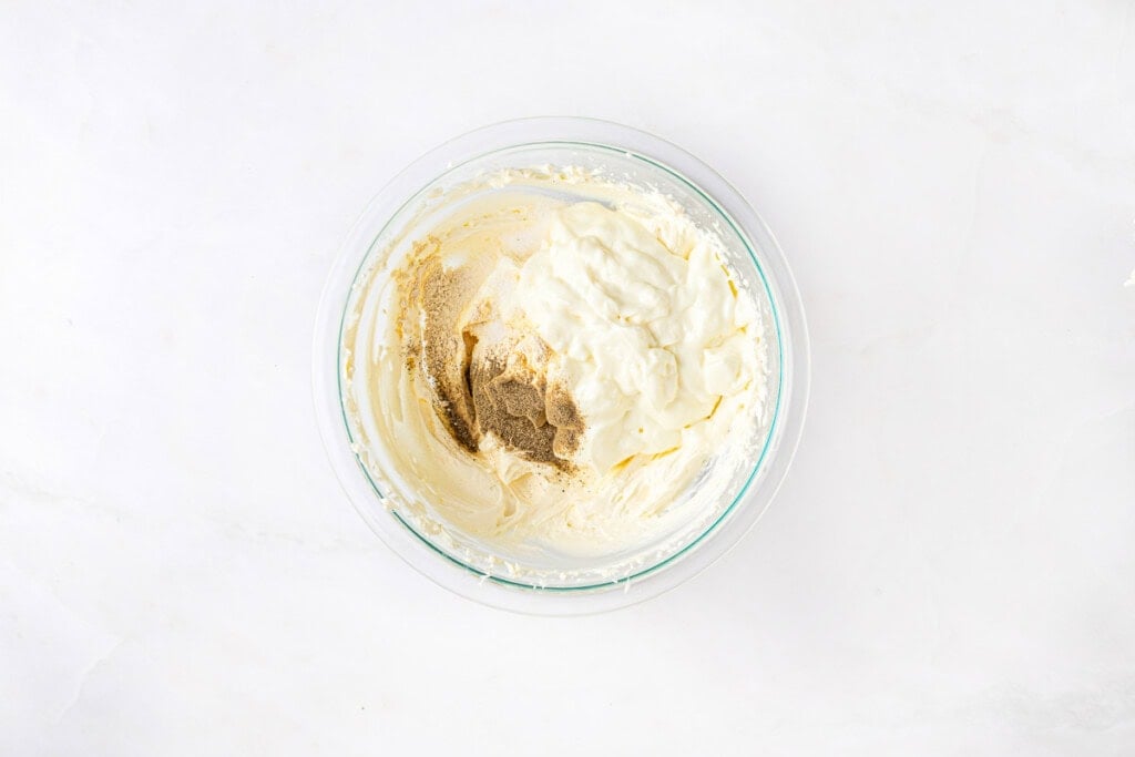 Combining ingredients for Cream Cheese Dip recipes.