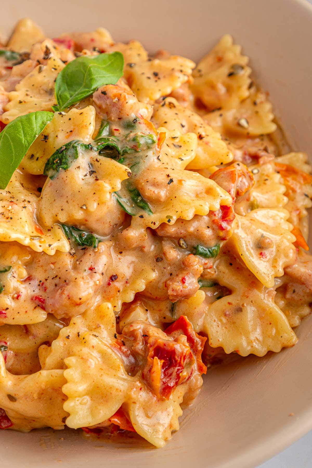 Creamy Sausage Pasta close-up with garnish.