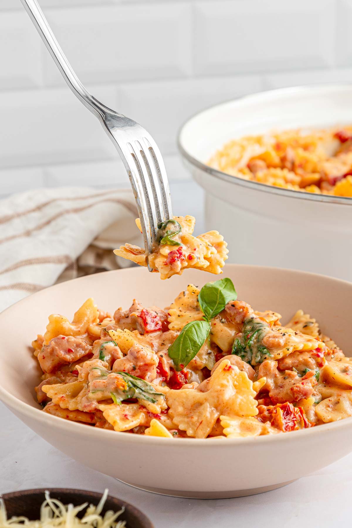 Creamy Sausage Pasta bite on fork.