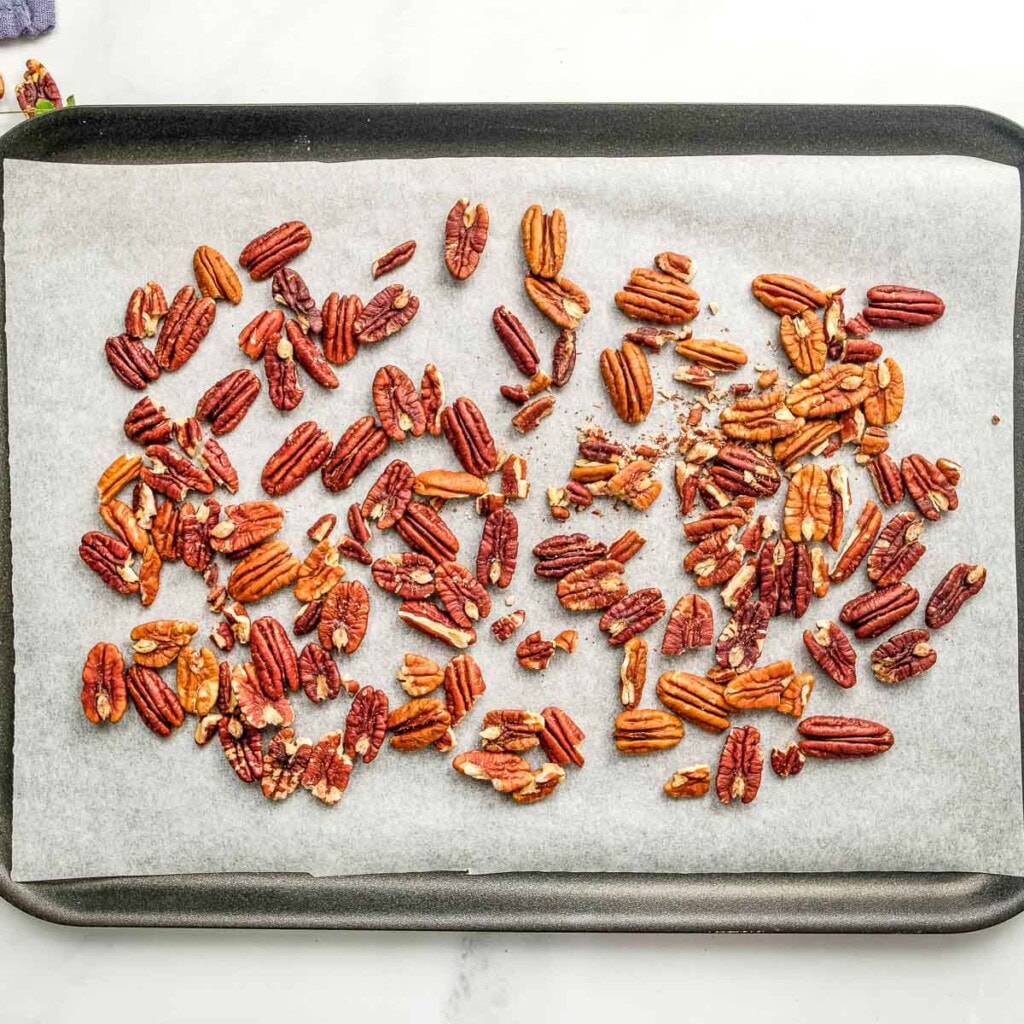 Toasting pecans on pan.