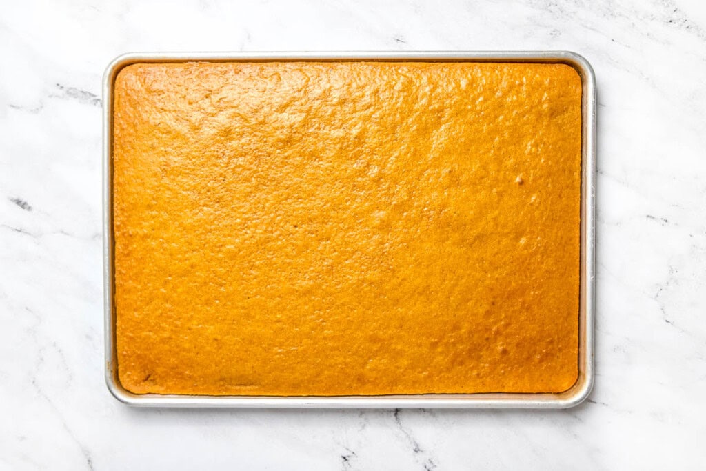 Pumpkin Bars with Cream Cheese Frosting in pan out of oven.