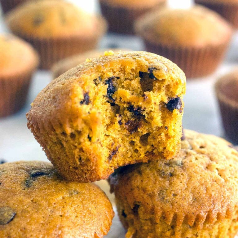 Pumpkin Chocolate Chip Muffins close-up with bite missing.
