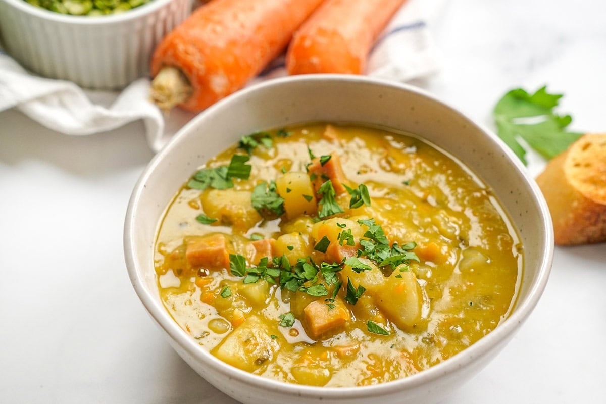 Slow Cooker Split Pea Soup with ham and potatoes close-up.
