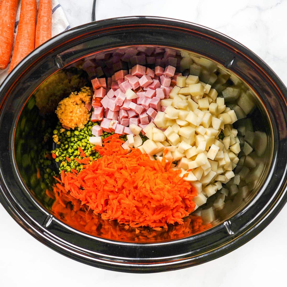 Slow Cooker Split Pea Soup ingredients in crock pot.