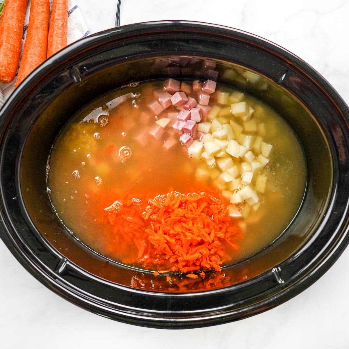 Liquid added to crockpot.