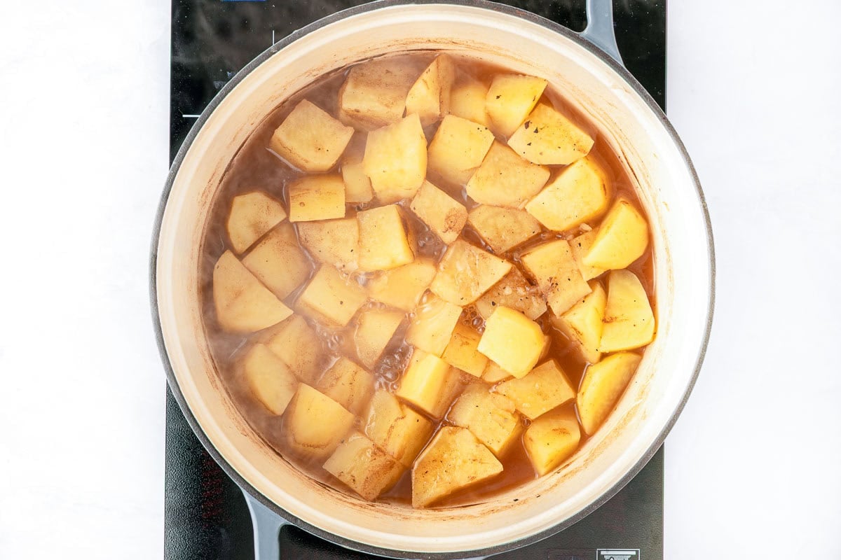 Cheesy Potato Soup simmering in pot.