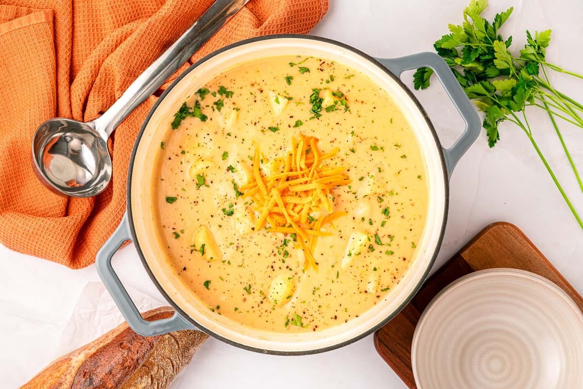 Aerial view of Cheesy Potato Soup in pot.