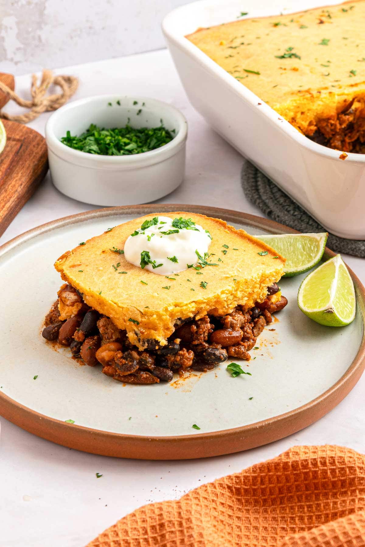 Chili Cornbread Casserole on plate and in baking dish.