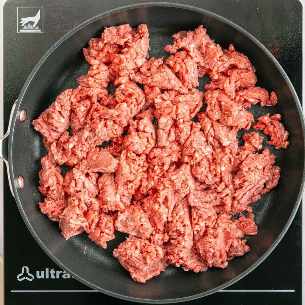 Ground beef in pan.