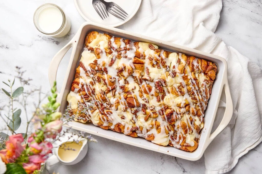Cinnamon Roll Casserole drizzled with icing.