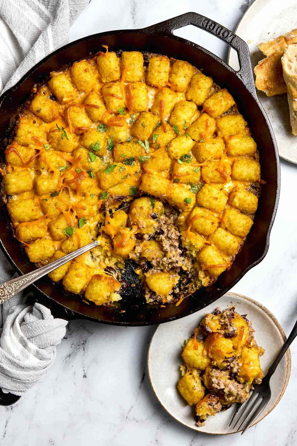 Cowboy Casserole aerial in skillet with missing serving.