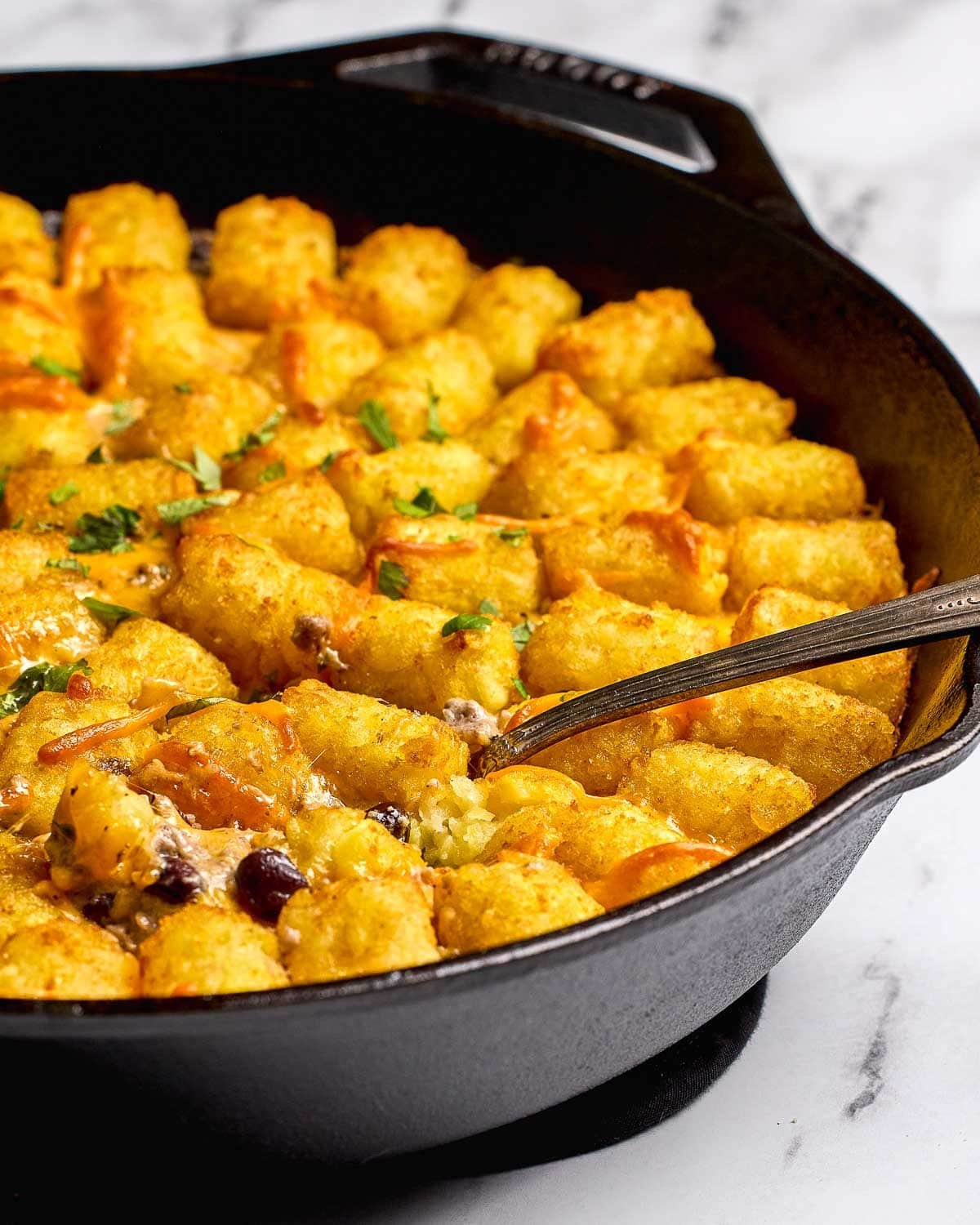 Cowboy Casserole with tater tots on top.